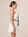 Woman_wearing_white_two-piece_set_2K_20260925190626.webp