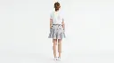 Woman_wearing_light_blue_skirt_2K_20260922182806.webp
