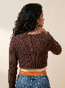 Woman_wearing_brown_ribbed_sweater_2K_20261004153739.webp