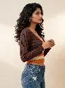 Woman_posing_in_brown_sweater_2K_20261004153735.webp