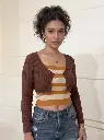 Woman_wearing_brown_ribbed_cardigan_2K_20261004154049.webp